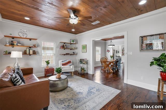 Cozy living room with shiplap ceilings and pine floors