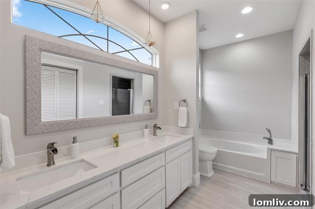 Spacious owner's suite with walk-in closet and designer bath