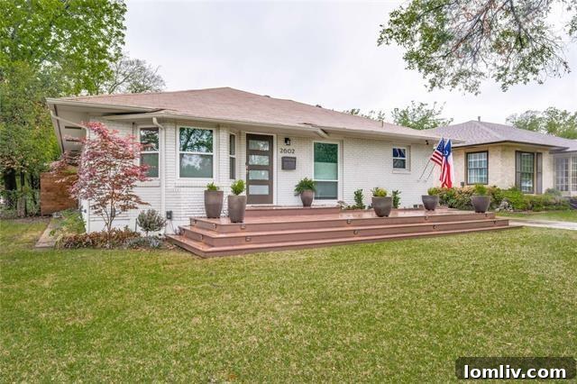 Fully renovated home exterior with charming front porch in Oak Cliff