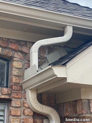 Unusual Gutter Design: A Slide-Like Downspout