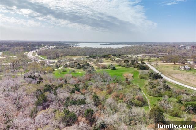 The lush and private backyard, offering abundant space for gardening and outdoor activities, with direct access to the scenic greenbelt.