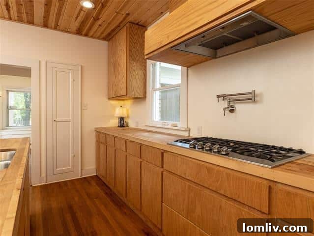 Spacious kitchen with Viking appliances and butcher block countertops
