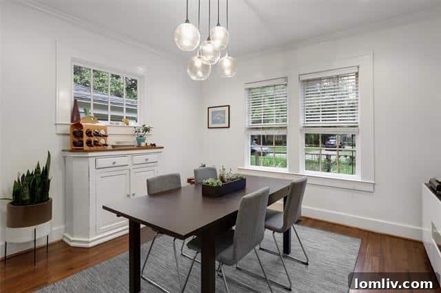 Elegant Dining Area with Large Windows and Garden Views