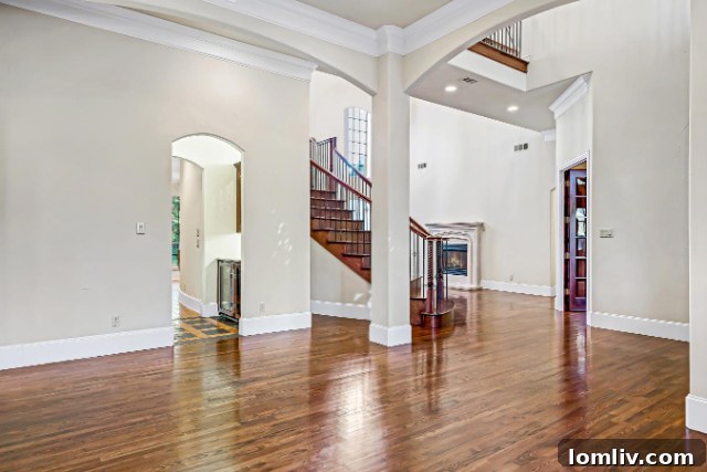 Elegant Foyer with grand staircase and soaring ceilings