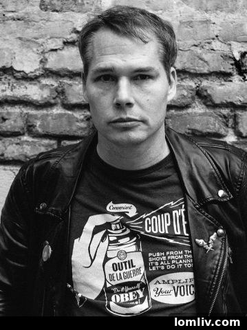 Portrait of artist Shepard Fairey on site during mural creation