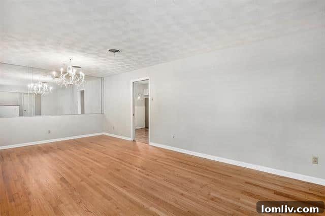 A glimpse into one of the cozy bedrooms in this 2-bed, 2-bath Dallas home, featuring classic details and ample light. Perfect for comfortable living.