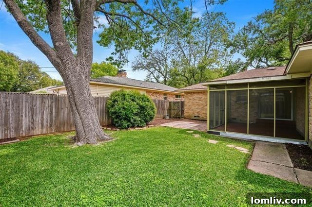 The exterior of the Buckner Terrace home, showcasing its inviting screened-in porch and potential for vibrant landscaping. Experience Dallas living at its best.