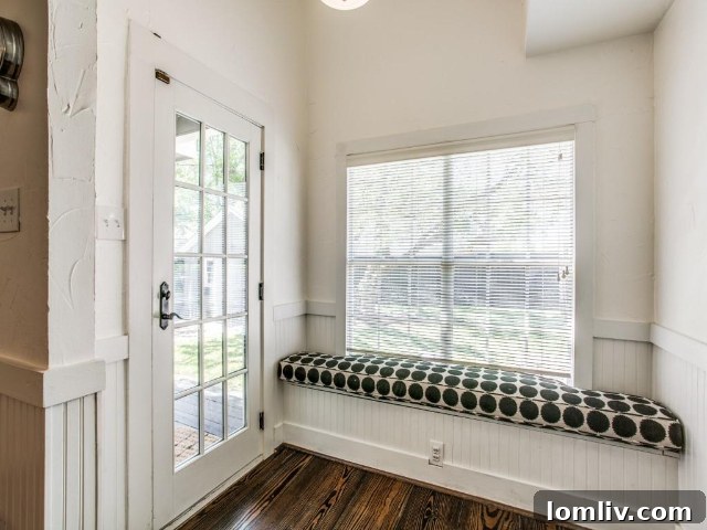 A renovated bathroom with unique dot tile details in the Greenland Hills Tudor.