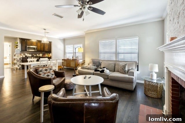 Seamless open concept living and dining area with hardwood floors