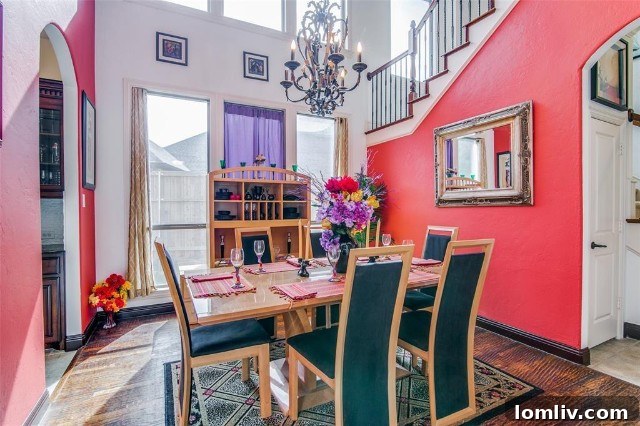 The dining room now, featuring bold colors and inviting furnishings, making it a central gathering space