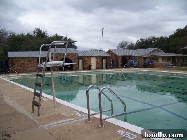 A view of the Tietze bathhouse, pavilion, and concessions before rehabilitation in February 2016, highlighting areas needing restoration.
