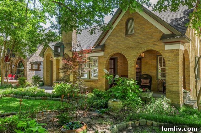 Stunning Tudor home at 6826 Vivian Avenue with covered front porch