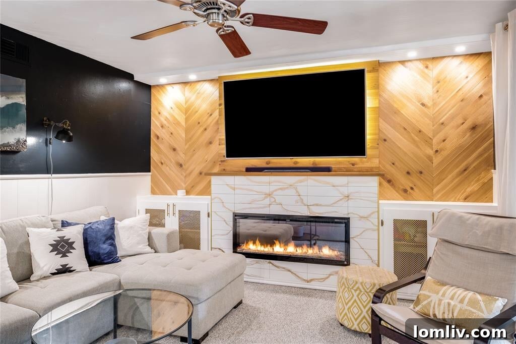 Charming rear living room with custom mantle and electric fireplace at 2468 Pinebluff Drive
