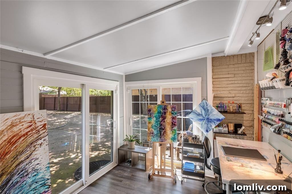 Beautifully designed backyard entertainment area with fire pit and mature trees at 2468 Pinebluff Drive