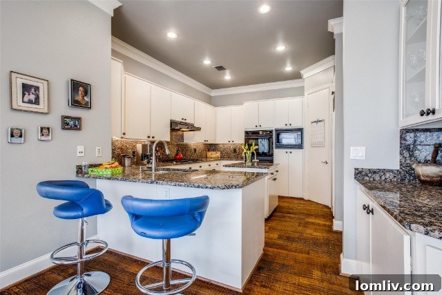 Spacious island kitchen with Sub-Zero appliances in 4012 Rawlins Street