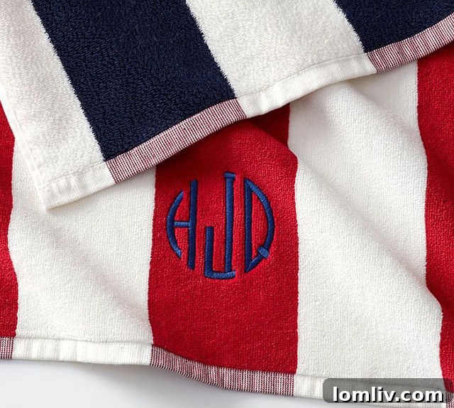 Plush, yarn-dyed reversible awning stripe organic cotton beach towels in red and navy