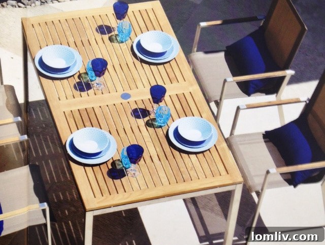 Cozy outdoor dining space with a beautifully decorated table and chairs