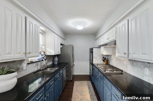 Completely renovated kitchen at 8541 Capri Drive with two-tone cabinets, new hardware, and stylish backsplash