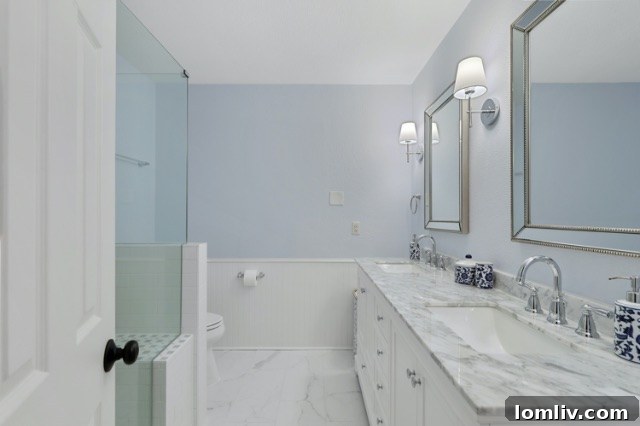 Luxurious modern bathroom at 8541 Capri Drive after full renovation with marble countertops and shower