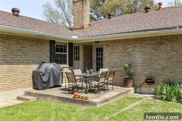 Original backyard at 8541 Capri Drive before landscaping and outdoor living space enhancements