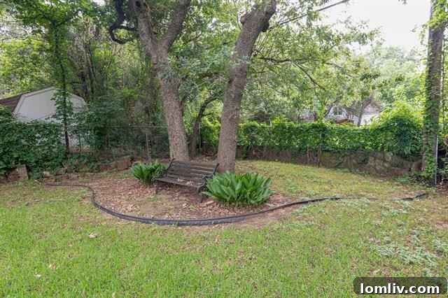 The charming and discreetly placed two-car garage in the backyard of the Oakhurst cottage, enhancing both functionality and curb appeal