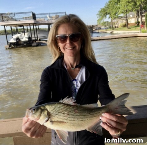 Debbie French smiling outdoors near Cedar Creek Lake