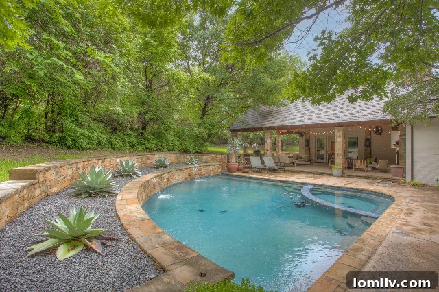 Expansive shade trees create a cool canopy over a beautiful Westover Hills residence