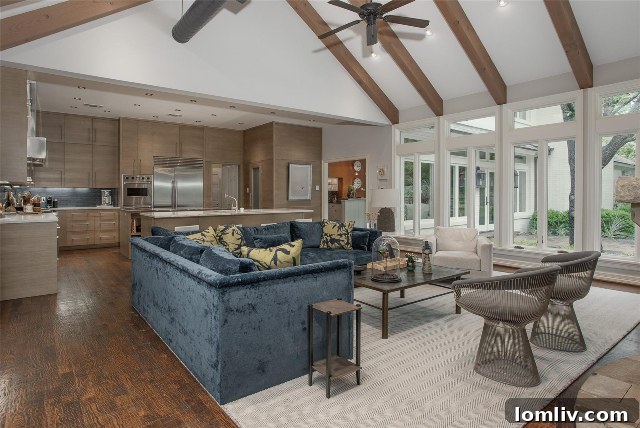 Elegant living room with large windows overlooking the natural landscape in a Westover Hills home