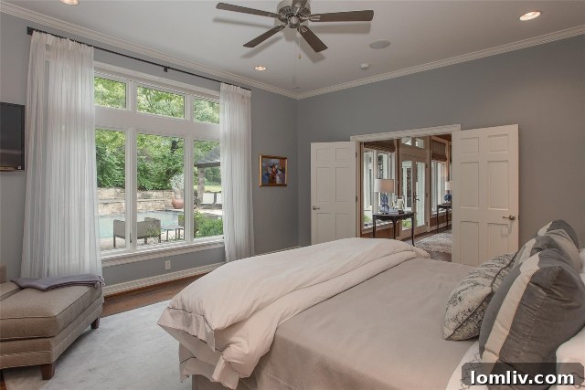 Bright primary bedroom suite with stunning outdoor views in a Texas luxury home