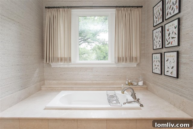 Luxurious primary bathroom with soaking tub and scenic views in a Fort Worth estate