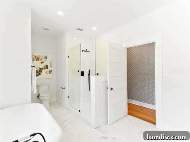 Luxurious Principal Bathroom with Claw-Foot Tub and Glass Shower