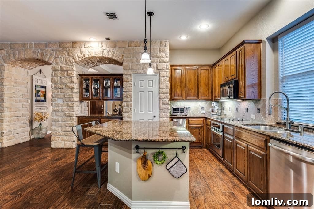 Spacious Kitchen with Island and Dining Area