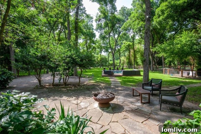Luxurious pool area surrounded by premium Ipe decking and expansive green lawn