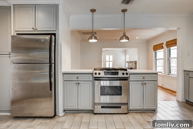 Exceptional Value Awaits in Arlington Heights 2-Bedroom Homes 8 Kitchen with a half wall design creating an open feel without major renovation.