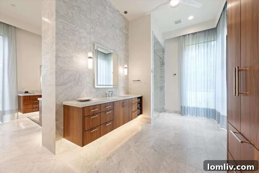 Luxurious primary bedroom suite with elegant decor and natural light