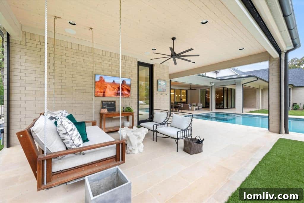 Professional regulation pickleball court with seating areas in a luxury backyard