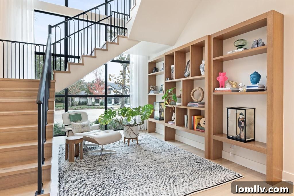 Elegant floating staircase with custom details and natural light in a luxury Southlake home
