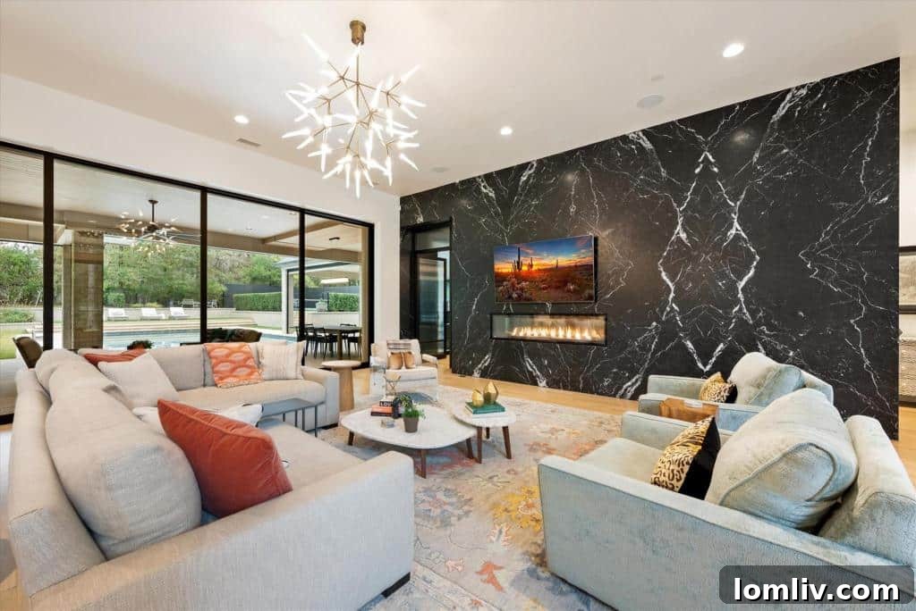 Luxurious Great Room with Nero Marquina marble wall and fireplace in 1501 Moss Lane