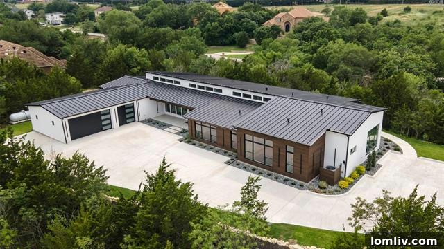Exterior view of a minimalist modern luxury estate on three acres in Fort Worth