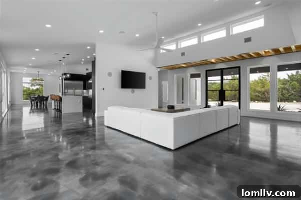 Contemporary kitchen with sleek design, island, and high-end appliances in luxury estate