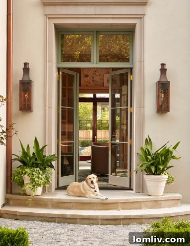 Luxurious living space with large windows and elegant decor, designed by Tracy Hardenburg, photograph by Nathan Schroder.