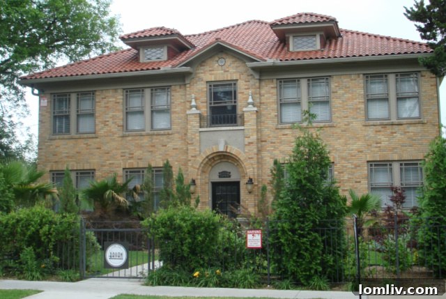 A 1928 eclectic Mediterranean style multi-family apartment building at 4928 Bryan Street