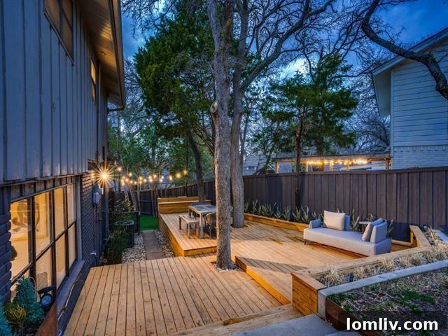 Expansive side yard with lush greenery and mature trees