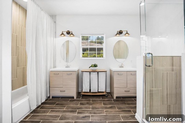 Spa-like primary bathroom with double vanities and separate shower/tub at 1731 Seevers Avenue