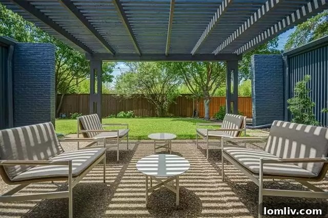 View of the private, enclosed patio, offering a serene outdoor retreat and alternative entrance