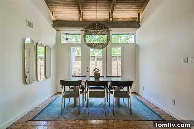 Elegant dining area with modern fixtures and classic midcentury design elements