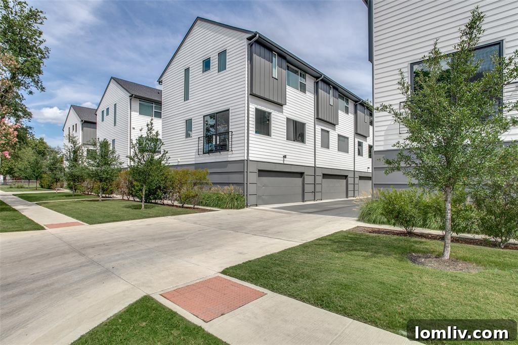Spacious open floor plan living area showcasing seamless flow from kitchen to dining to den
