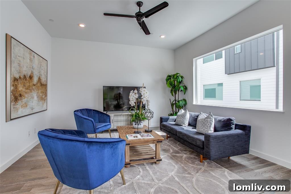 Elegant dining area with modern chandelier, positioned adjacent to the gourmet kitchen in an open concept layout