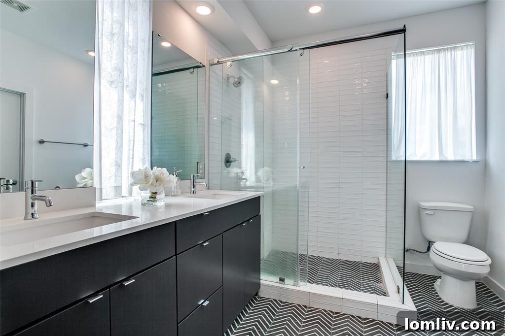 Bright and spacious secondary bedroom featuring ample natural light and modern finishes, with en suite bathroom access