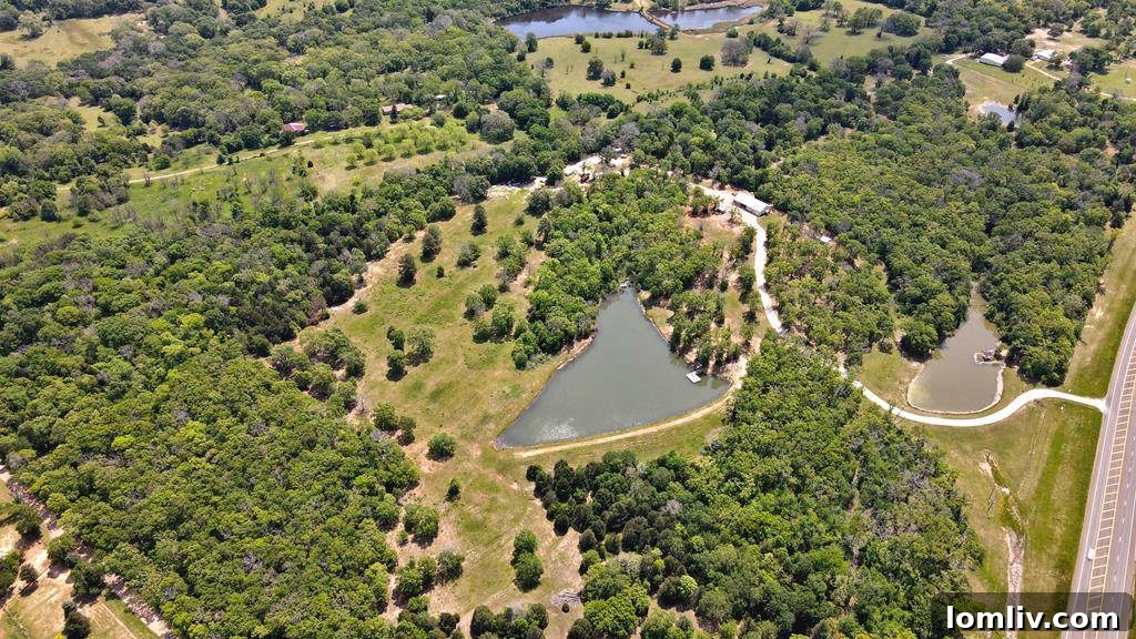 Expansive aerial view of a private barndominium estate in Athens, Texas